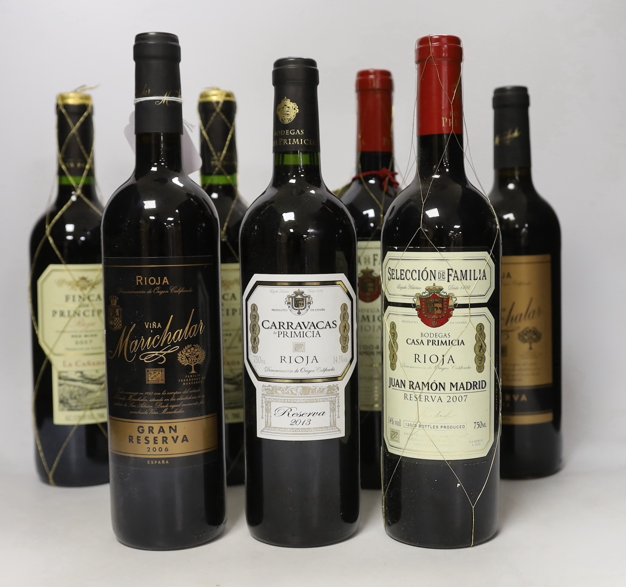 Twelve various bottles of Rioja: one bottle of 2004 Bodegas Primacia Rioja and five bottles of Bodegas Primacia 2007, a bottle of Ermita de San Lorenzo 2002 and five various bottles of Rioja, wine